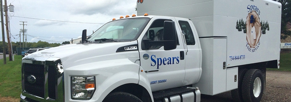 A white truck with the word " spears " on it.